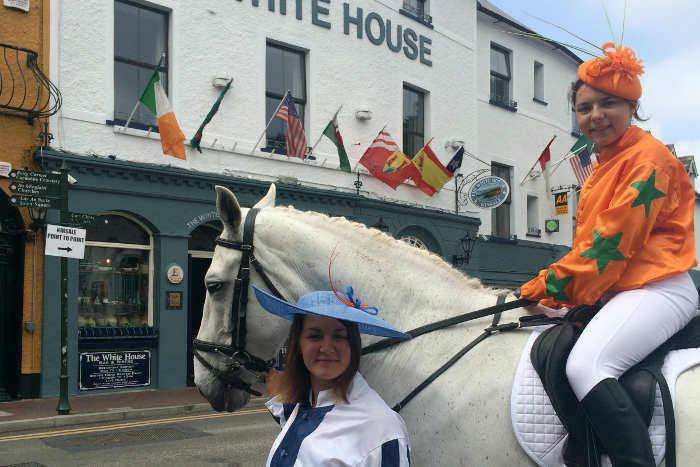 Photograph of hunt horse and female jockey outside The White House in Kinsale