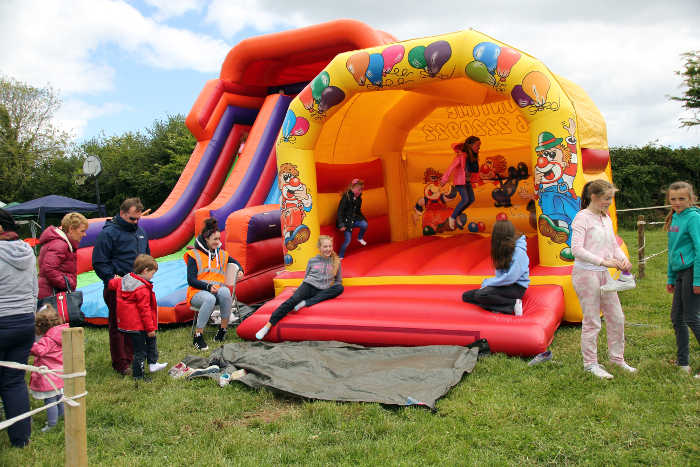 Photograph of Bouncy Castle and Inflatable slide with children playing